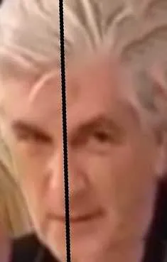 Blurred portrait of a grey-haired man looking toward the camera